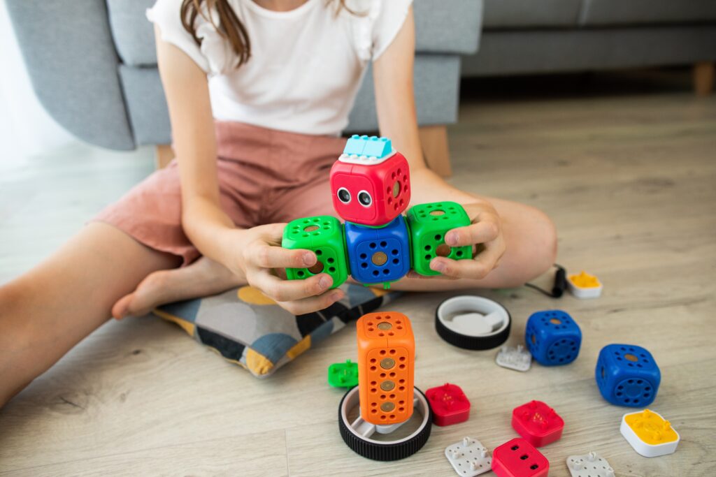 feminist children's toys - girl playing with engineering toys